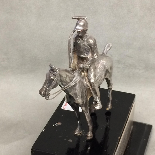 78 - Sterling silver model of a seated polo player on a polo pony,  with Sterling silver polo mallett, by... 