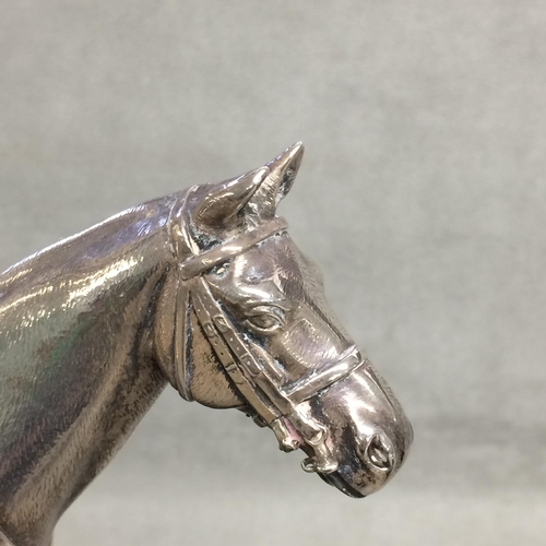 78 - Sterling silver model of a seated polo player on a polo pony,  with Sterling silver polo mallett, by... 