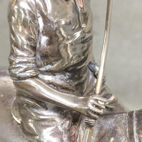 78 - Sterling silver model of a seated polo player on a polo pony,  with Sterling silver polo mallett, by... 