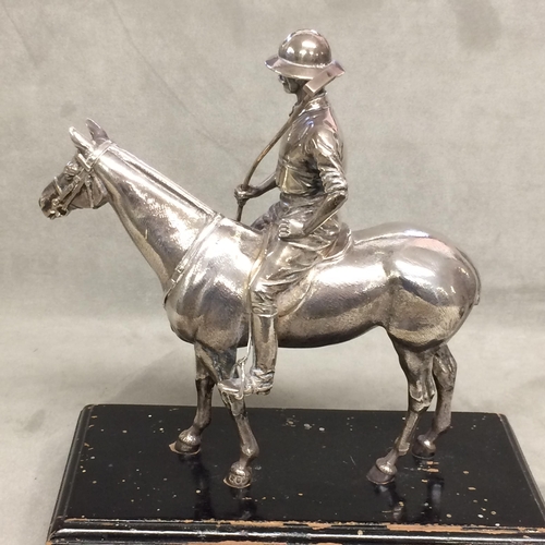 78 - Sterling silver model of a seated polo player on a polo pony,  with Sterling silver polo mallett, by... 