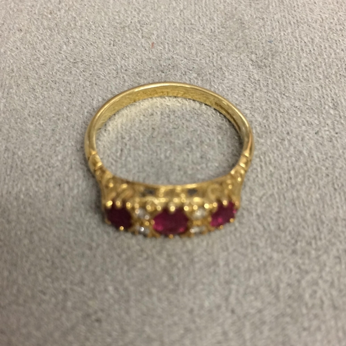 83 - 18ct old 3 stone ruby ring with single cut diamond acc 3.3g size N