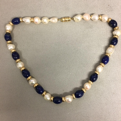 9 - Baroque Pearl and lapis necklace strand on a 14ct gold clasp, 40cm