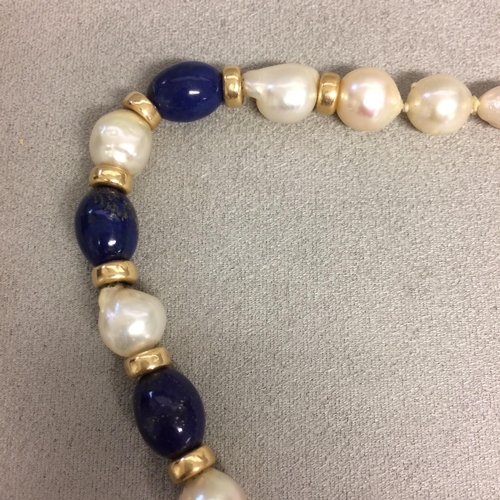 9 - Baroque Pearl and lapis necklace strand on a 14ct gold clasp, 40cm