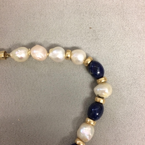 9 - Baroque Pearl and lapis necklace strand on a 14ct gold clasp, 40cm