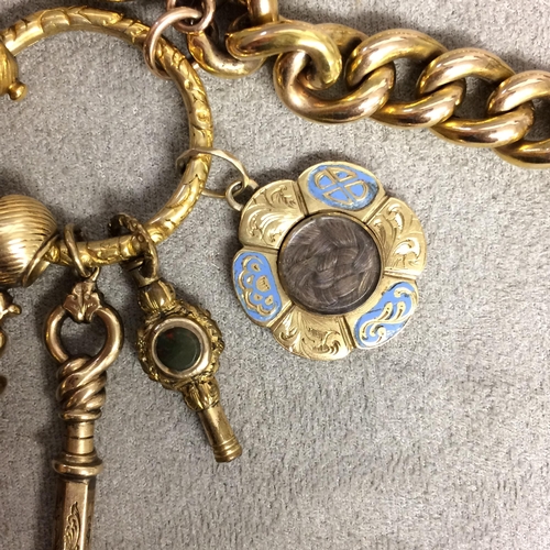 90 - 15ct gold flat curb link charm bracelet with spade guinea, 2 gilt metal watch fobs, 9 ct cross and 2... 