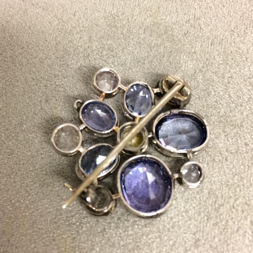 97 - Unmarked white metal sapphire and fancy sapphire  brooch 9.7g (some inclusions to one of the big blu... 