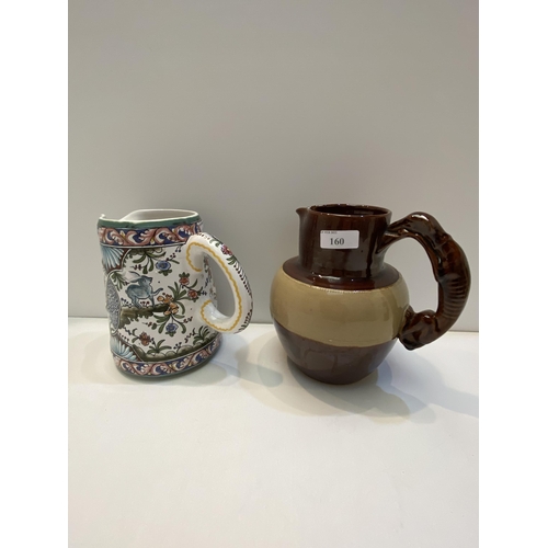 442 - Two jugs, 1 hand painted Portugal jug, and  a Denbigh brown glazed