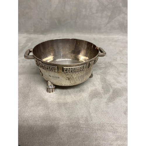 1 - An Arts and Crafts Sterling silver twin handled bowl with planished finish and applied cast inscript... 