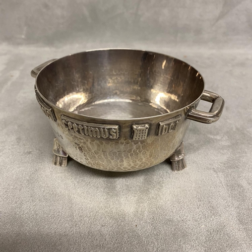 1 - An Arts and Crafts Sterling silver twin handled bowl with planished finish and applied cast inscript... 