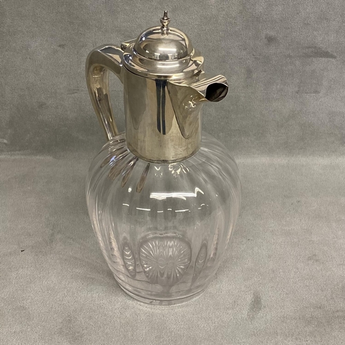 10 - A sterling silver topped claret jug of bulbous reeded design and star base, by Alexander Clark & Co ... 