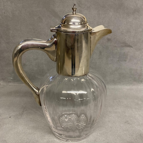 10 - A sterling silver topped claret jug of bulbous reeded design and star base, by Alexander Clark & Co ... 