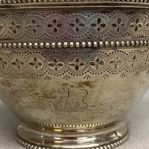 11 - A Victorian sterling silver bowl, swing handle with chased decoration, beaded rim and gilt interior ... 