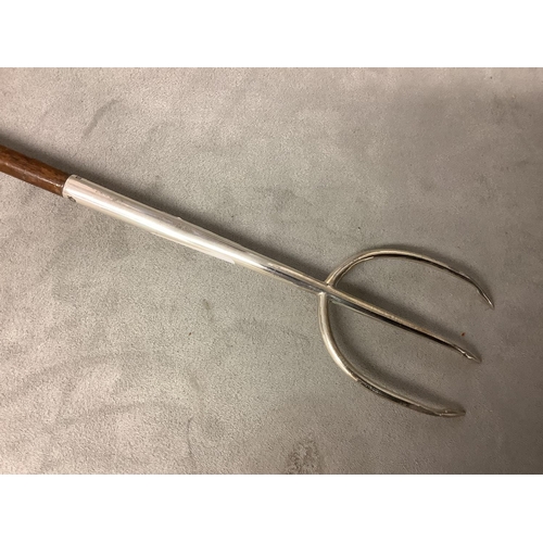 115 - A large silver mounted toasting fork with turned handle, 82cm, by Elkington and co 1911