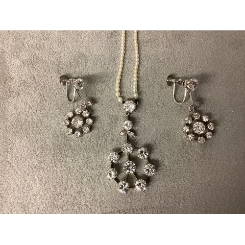 116 - A good platinum and diamond pendant and earing suite, pendant set with eight brilliant cut diamond i... 