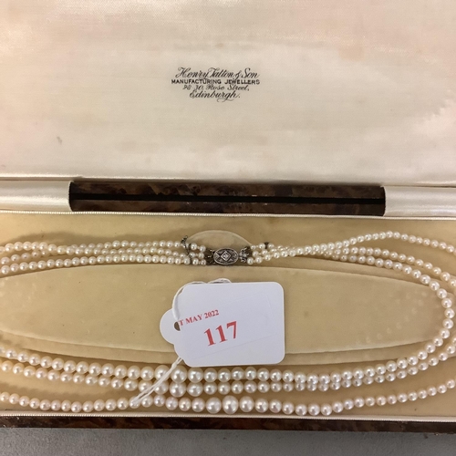 117 - A triple stand of pearls on a diamond set white metal clasp boxed. Largest pearl approx 6mm, approx ... 