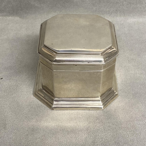 12 - A Scottish sterling silver octagonal lidded box on stepped octagonal foot, by Hamilton and Inches, E... 