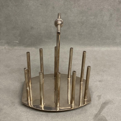 20 - A silver plated toast rack, designed by Dr C Dresser, with kite mark to base, a stamped designed by ... 