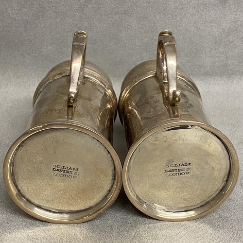 24 - A pair of Britannia silver pepperettes, each with single looped handle, hallmarked Dublin, maker GG ... 