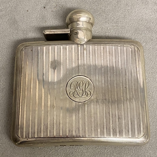 25 - A Sterling silver hip flask with engine turned decoration by Sampson Morden & Co London 1919, 120g