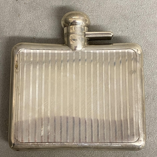 25 - A Sterling silver hip flask with engine turned decoration by Sampson Morden & Co London 1919, 120g