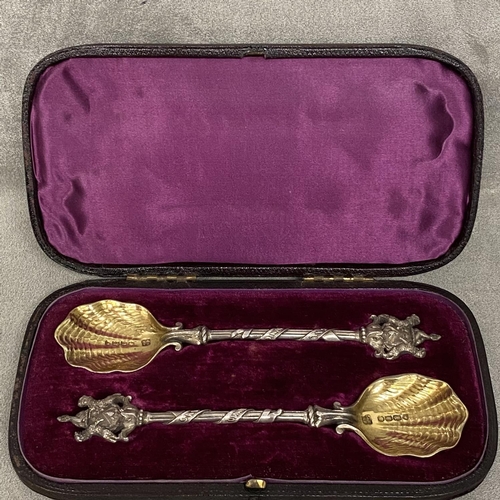 31 - A cased pair of large Victorian salt spoons for the Worshipful company of Salters with Company crest... 