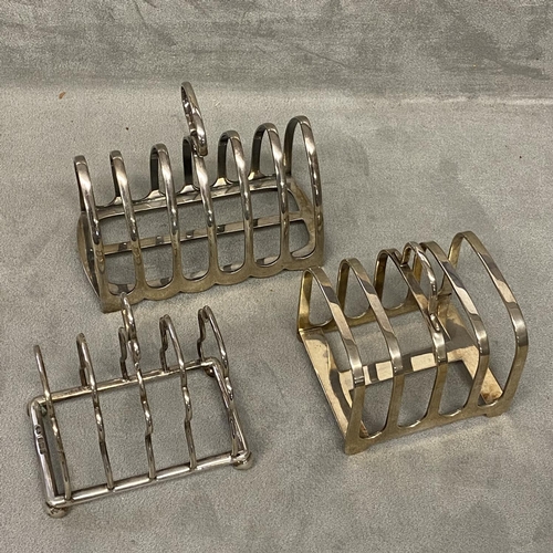 36 - Three Sterling silver toast racks, two four division and one six division 310 gn, various makers and... 