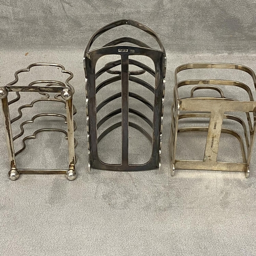 36 - Three Sterling silver toast racks, two four division and one six division 310 gn, various makers and... 