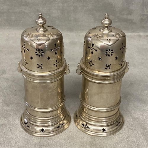 37 - Pair of Sterling silver sugar sifters by Garrard & Co, London, 1894, 225g 10.5cm high