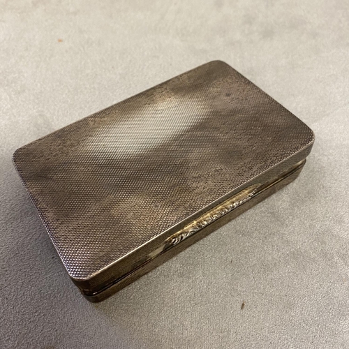 40 - A sterling silver engine turned snuff box with gilt interior, retailed by Garrards & Co, by Plante &... 