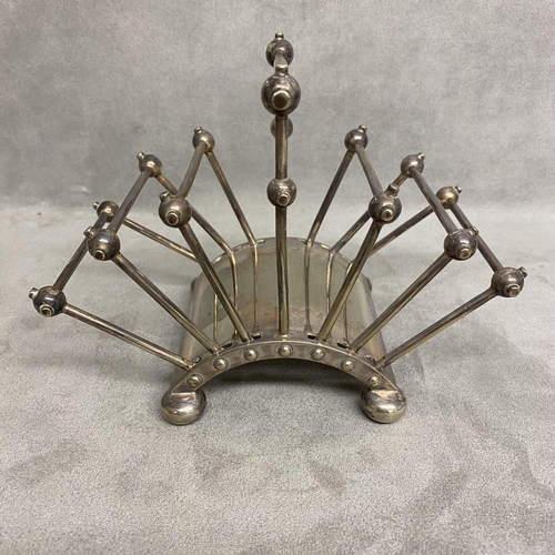 5 - A Hukin and Heath electroplated folded toast rack, designed by Dr Christopher Dresser Model number 2... 