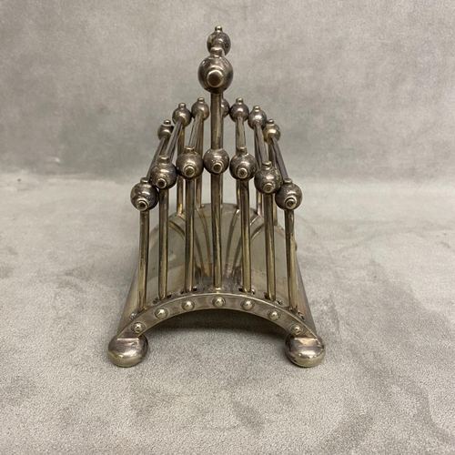 5 - A Hukin and Heath electroplated folded toast rack, designed by Dr Christopher Dresser Model number 2... 