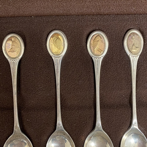 63 - Wooden cased set of spoons 