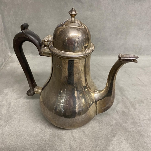 7 - A sterling silver coffee pot of bulbous form on circular base, Goldsmiths Silversmiths Company Ltd, ... 