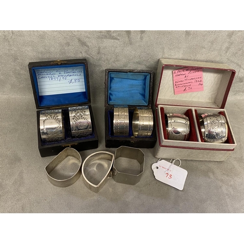 75 - A collection of Sterling silver napkin rings to include 3 boxed pairs and 3 single examples, various... 