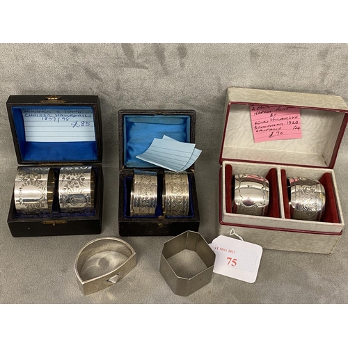 75 - A collection of Sterling silver napkin rings to include 3 boxed pairs and 3 single examples, various... 