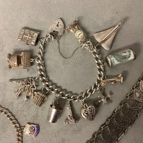 123 - Jewellery to include: A white metal coin bracelet (not hallmarked), and Sterling Silver charm bracel... 