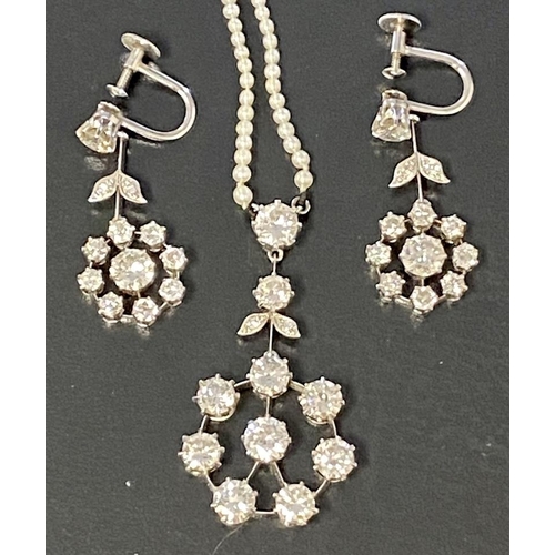 116 - A good platinum and diamond pendant and earing suite, pendant set with eight brilliant cut diamond i... 