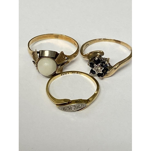 122 - An C18ct gold and diamond three stone ring, a 18ct gold and pearl set ring, and a 9ct gold sapphire ... 