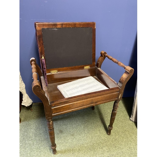 624 - A mahogany piano stool, with purple button backed upholstery