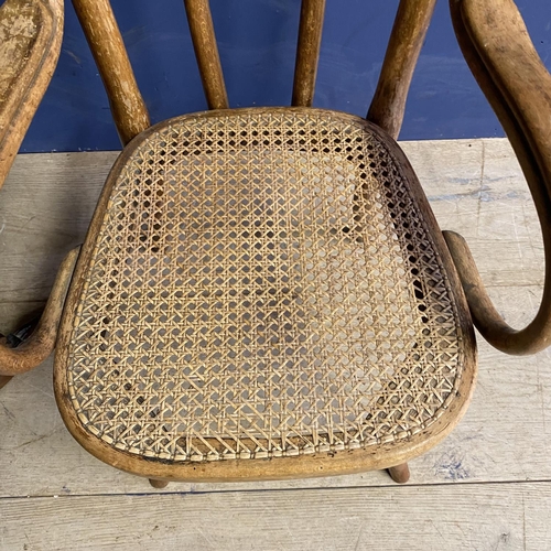 207 - Childs elm chair, with bergere seat, some fading and wear to caning, and a small swing toilet mirror... 