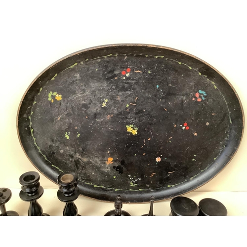 211 - A black oval decorative papier mache tray together with turned ebonised wooden items. Tray 55 x 40cm