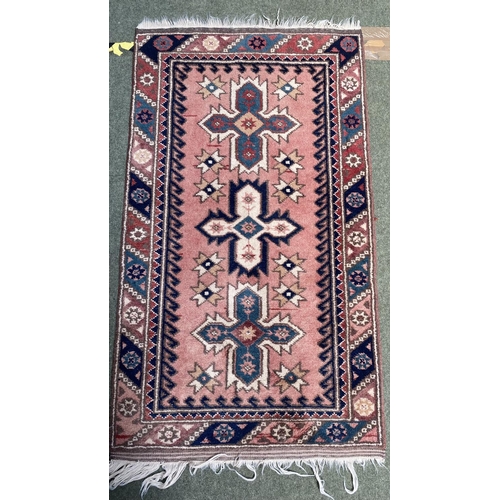 652 - Small oriental rug, pink with blue and cream borders, 126 x 73cm