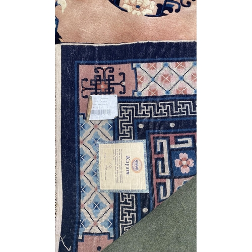 653 - Cream Laura Ashley Isodore rug, wooll pile 159 x 229cm, and a pink and blue wool Chinese rug KAYM