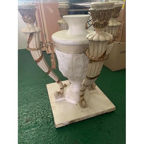 457 - A contemporary and decorative glass occasional table, with marble base of four sconces and a central... 