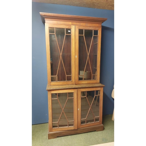 466 - Two part faded mahogany and chequer board inlaid glazed bookcase; as found