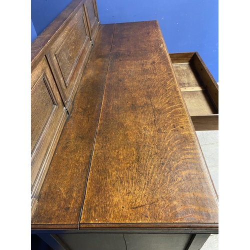 615 - An oak sideboard, with 4 drawers and cupboards,178cm Wide