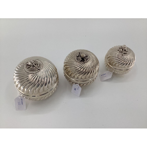 10 - Set of 3 graduated white metal lidded bowls, with reeded decoration flower finials, gilt interior, s... 