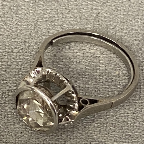 128 - Continental platinum and diamond single stone ring, in pierced halo setting, single rose cut diamond... 