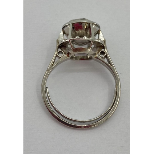 128 - Continental platinum and diamond single stone ring, in pierced halo setting, single rose cut diamond... 