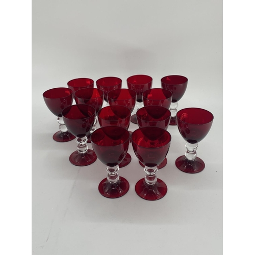 161 - Collection of cranberry glass glasses by Thomas Goode to include 14 white wine, 14 red wine glasses